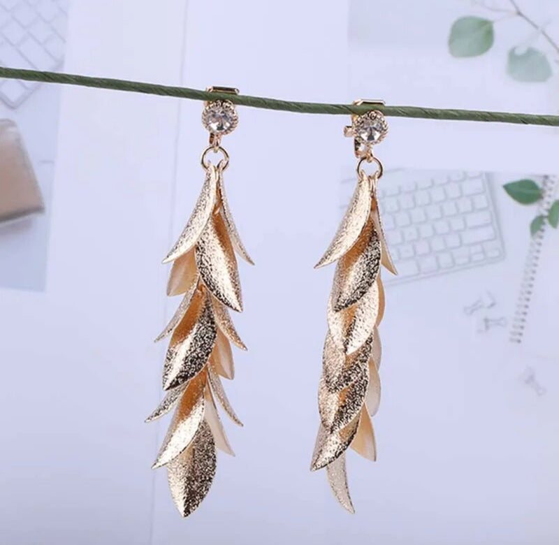 Clip on gold or silver clear stone 3" long textured bent leaf earrings