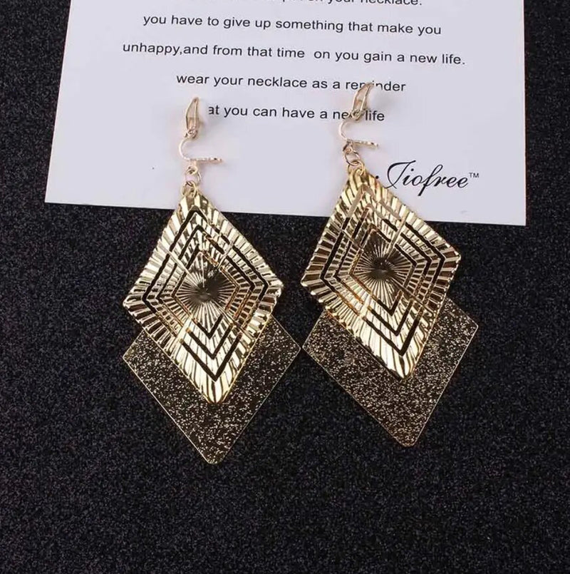 Clip on 3 3/4" long gold textured and indented square dangle earrings