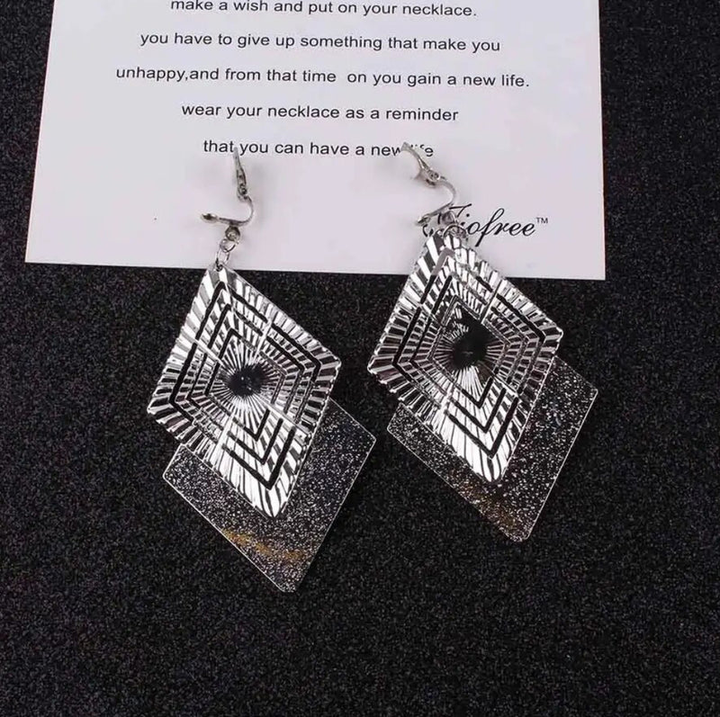 Clip on 3 3/4" long silver textured and indented square dangle earrings