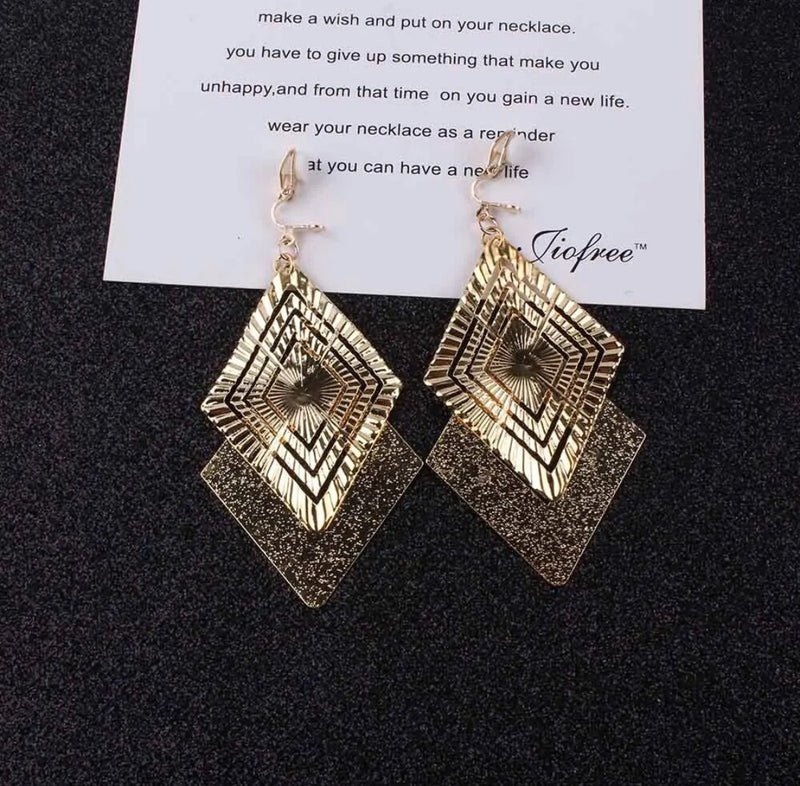 Clip on 3 3/4" long gold textured and indented square dangle earrings