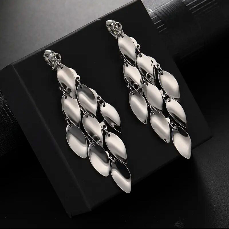 Clip on 3 3/4" shiny silver layered bent leaf earrings