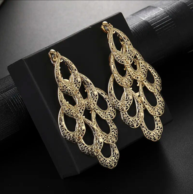 Clip on 4 1/4" long silver cutout lace style oval dangle earrings