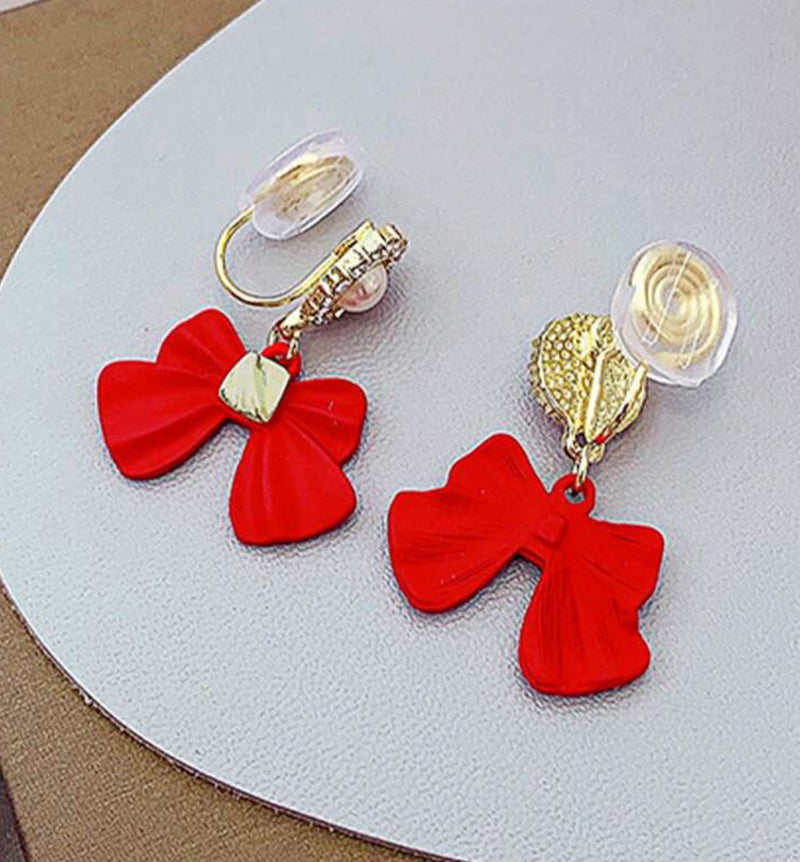 Comfort fit 1 1/4" gold and red bow dangle earrings w/clear stones & pearl