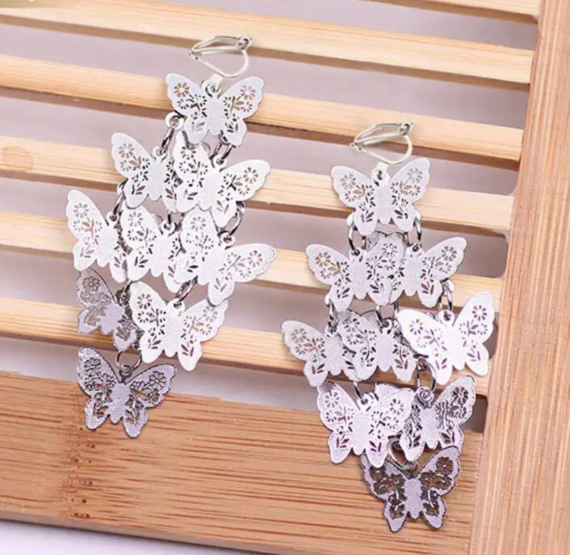 Clip on 2 1/4" silver textured layered butterfly earrings