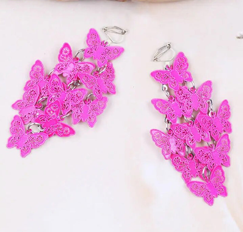 Clip on 2 1/4" silver and pink textured butterfly cluster earrings