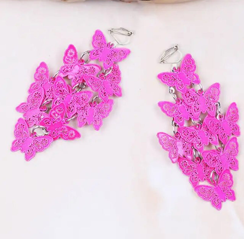 Clip on 2 1/4" silver and pink textured butterfly cluster earrings