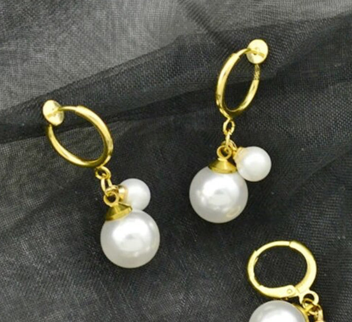 Clip on 1 1/4" gold hoop earrings with dangle white pearls