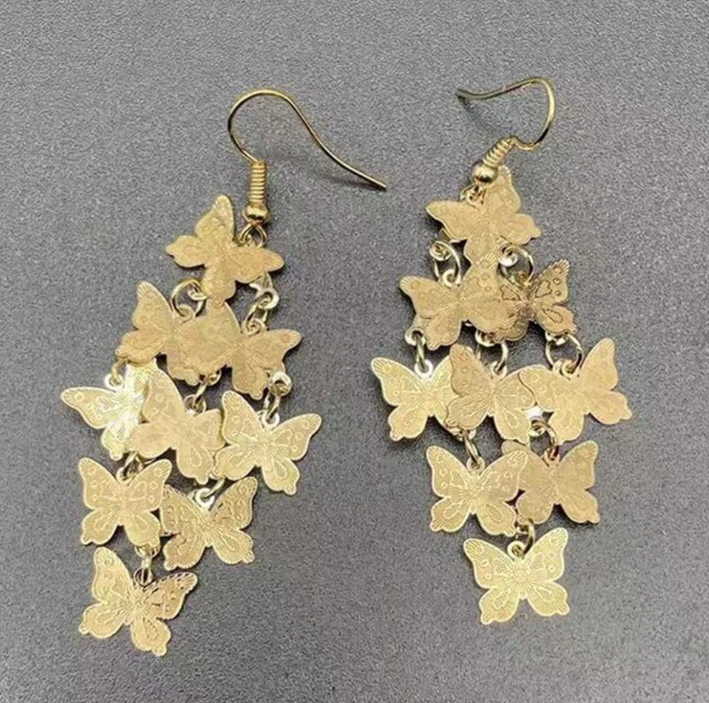 Pierced 2 3/4" gold layered butterfly dangle earrings