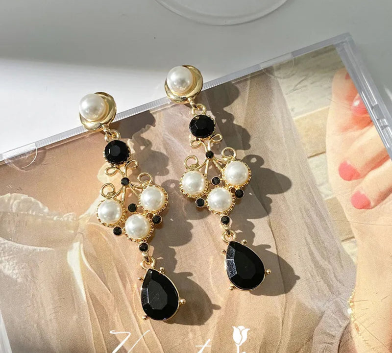 Vintage 2 3/4" clip on gold, black and white pearl dangle earrings