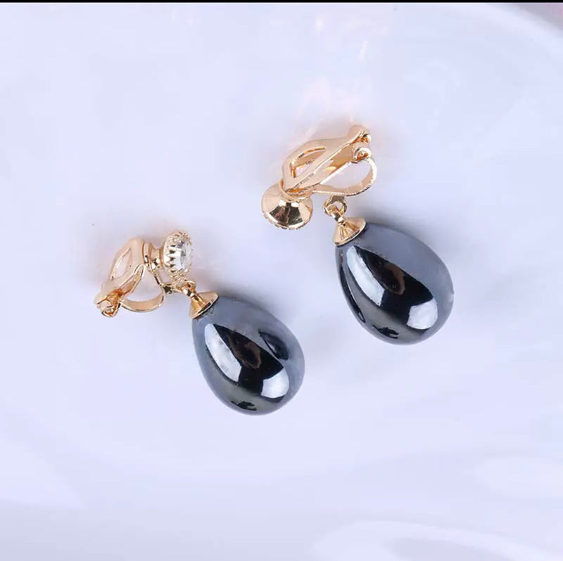 Clip on 1 1/4" gold and shiny gray dangle teardrop bead earrings