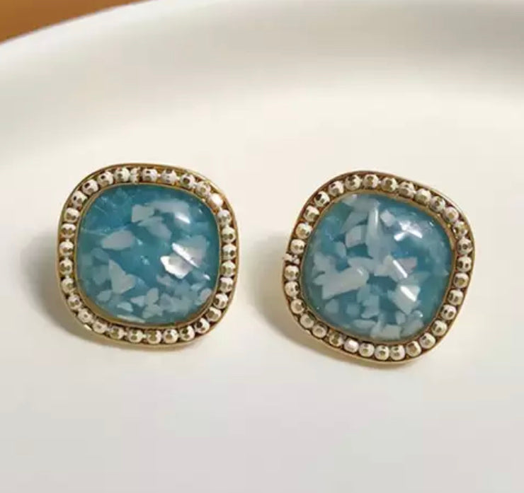 Clip on 3/4" gold and blue stone square earrings w/white pieces in stone