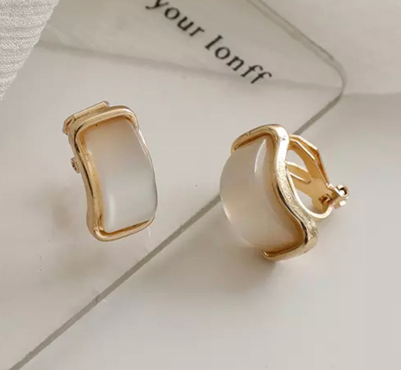 Clip on 1/2" small bent gold and cream stone earrings