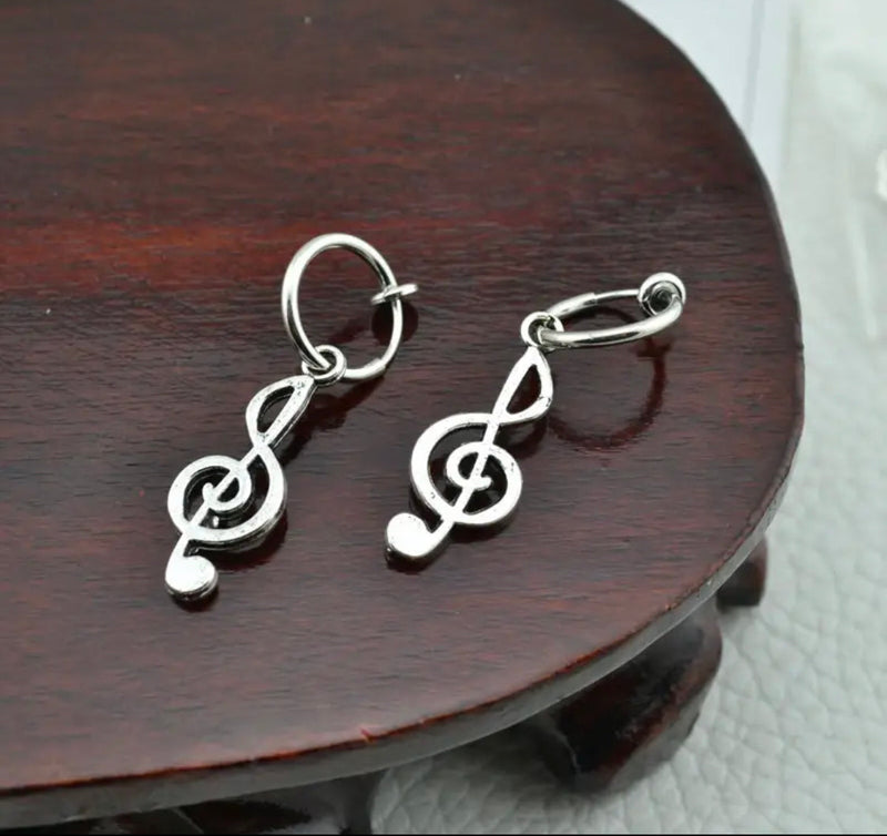 Clip on 1 3/4" silver hoop earrings with dangle music note