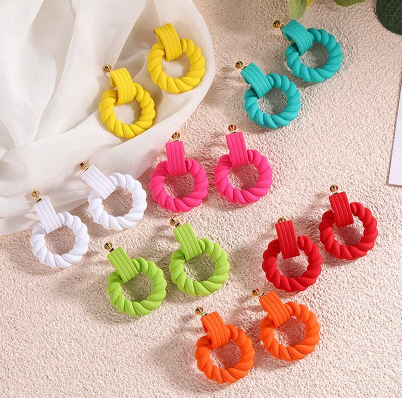 Clip on 1 3/4"gold plastic rope style hoop earrings in a variety of colors
