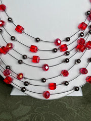 Clip on gunmetal and red bead multi strand black wire necklace and earring set