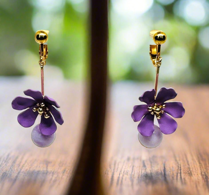 Clip on 2" gold wire and purple flower earrings with a dangle purple bead