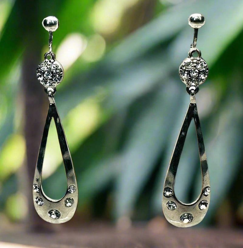 Clip on 2 3/4" silver and clear stone dangle cutout skinny teardrop earrings