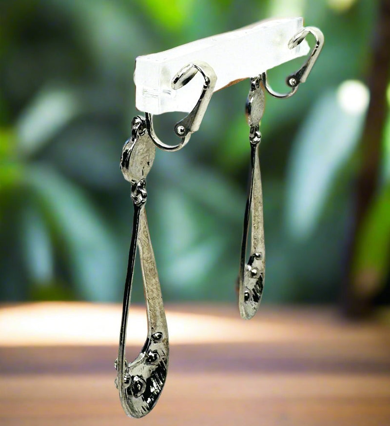 Clip on 2 3/4" silver and clear stone dangle cutout skinny teardrop earrings