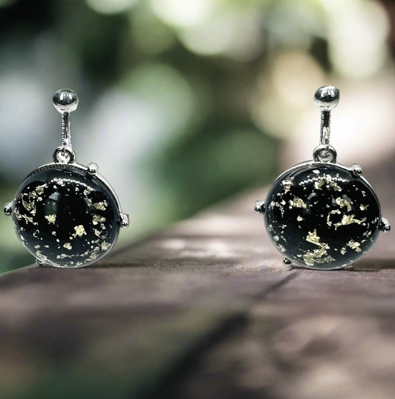 Clip on 1 1/2" silver, black and gold glitter round stone earrings