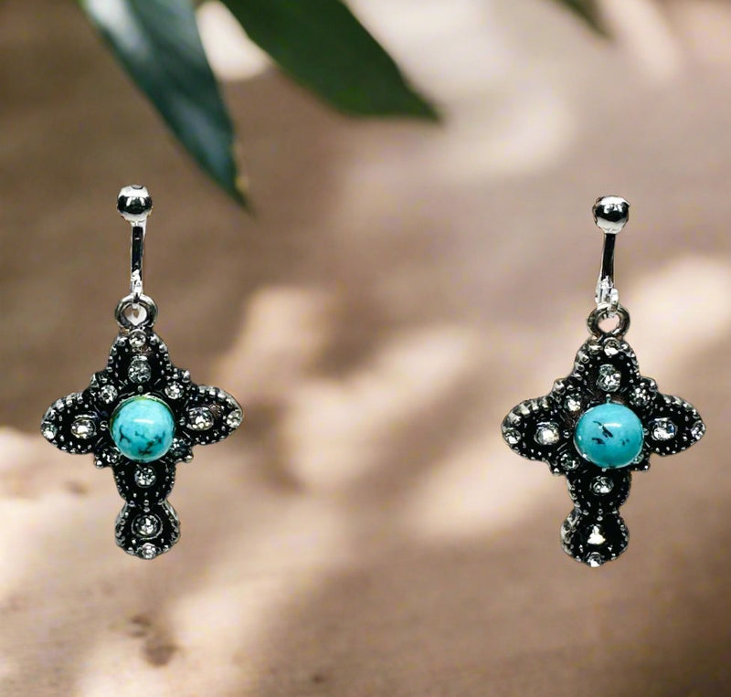 Clip on 1 1/2" silver clear stone cross earrings with turquoise center stone