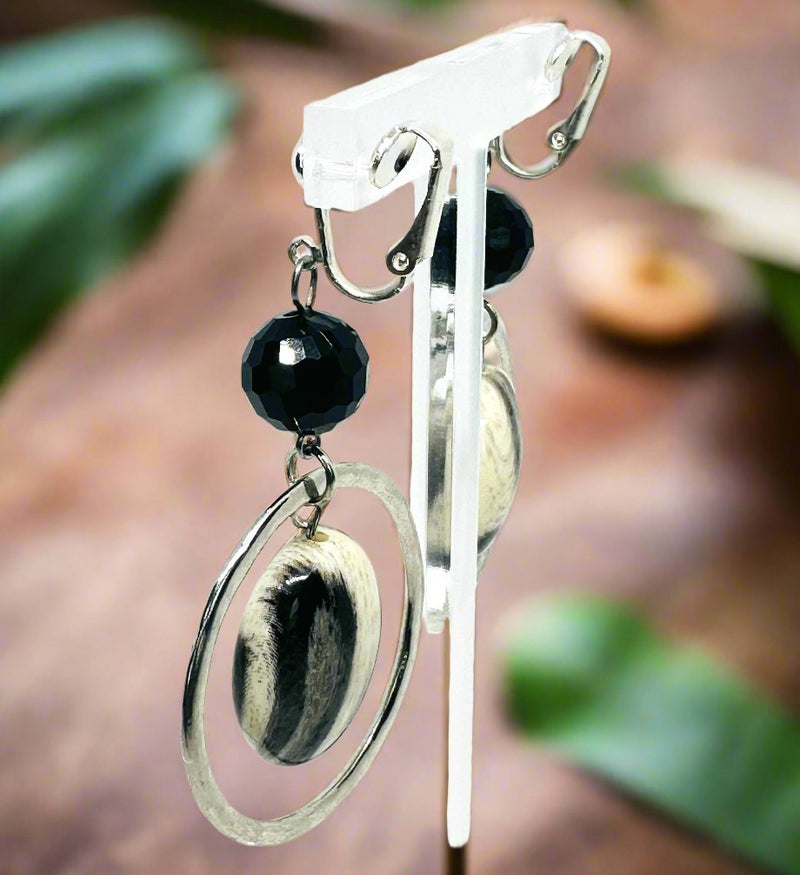 Clip on 2 3/4" silver hoop earrings with center black and white bead