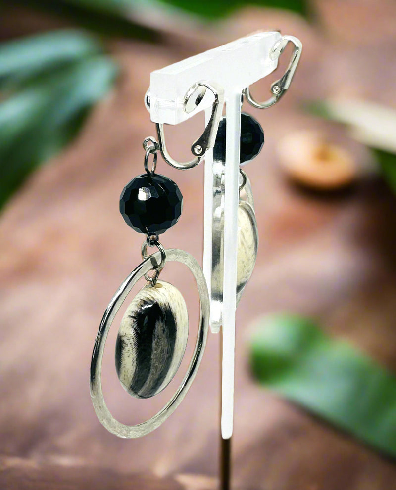 Clip on 2 3/4" silver hoop earrings with center black and white bead