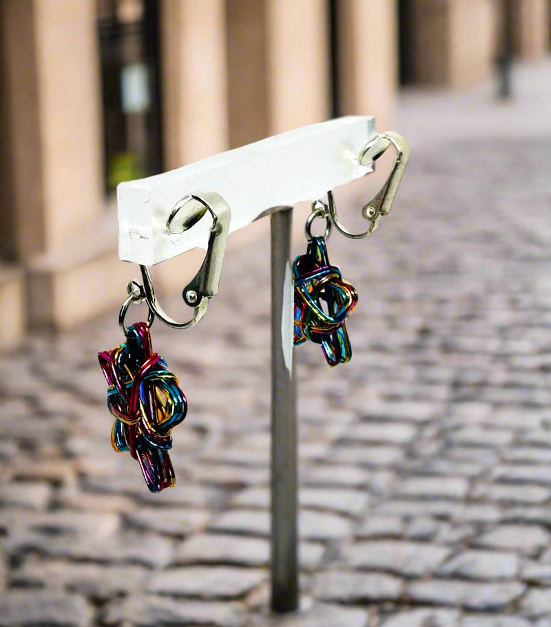 Clip on 1 1/2" silver wire pink, blue multi colored dangle star earrings