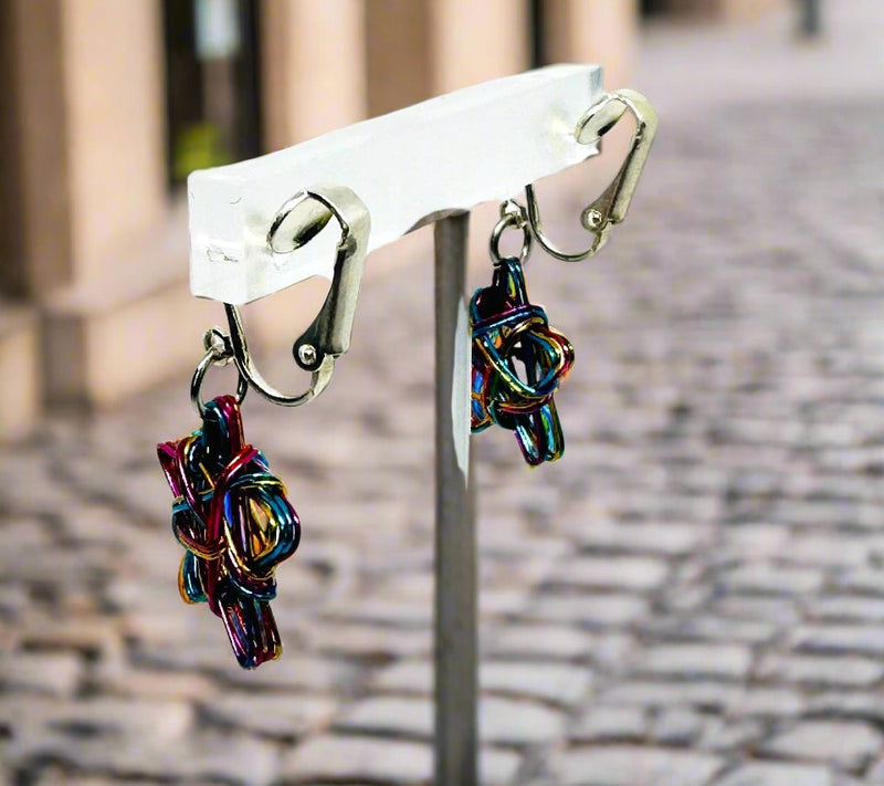 Clip on 1 1/2" silver wire pink, blue multi colored dangle star earrings