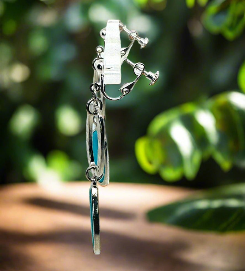 Clip on 2 3/4" silver earrings with dangle flat turquoise stone