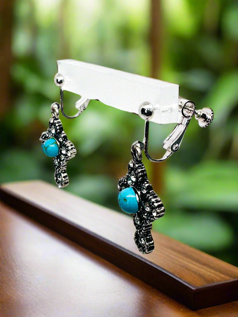 Clip on 1 3/4" silver, turquoise and clear stone dangle cross earrings