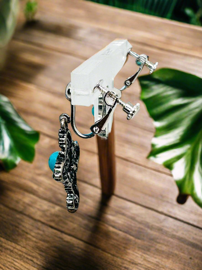 Clip on 1 3/4" silver, turquoise and clear stone dangle cross earrings