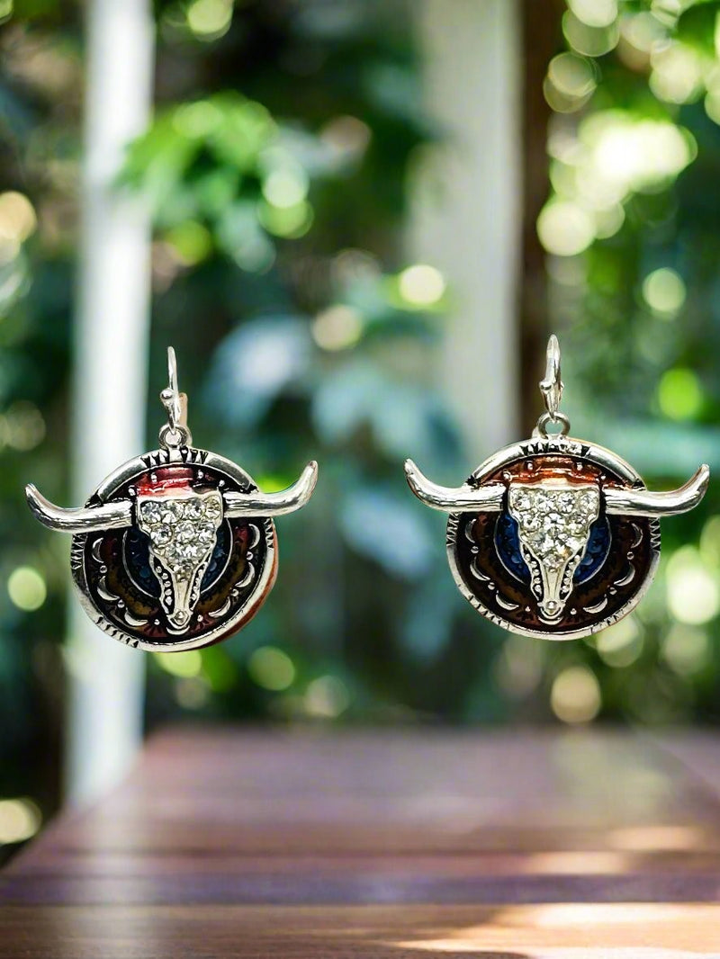 Pierced 2 3/4" silver, brown, and blue bull earrings with clear stones