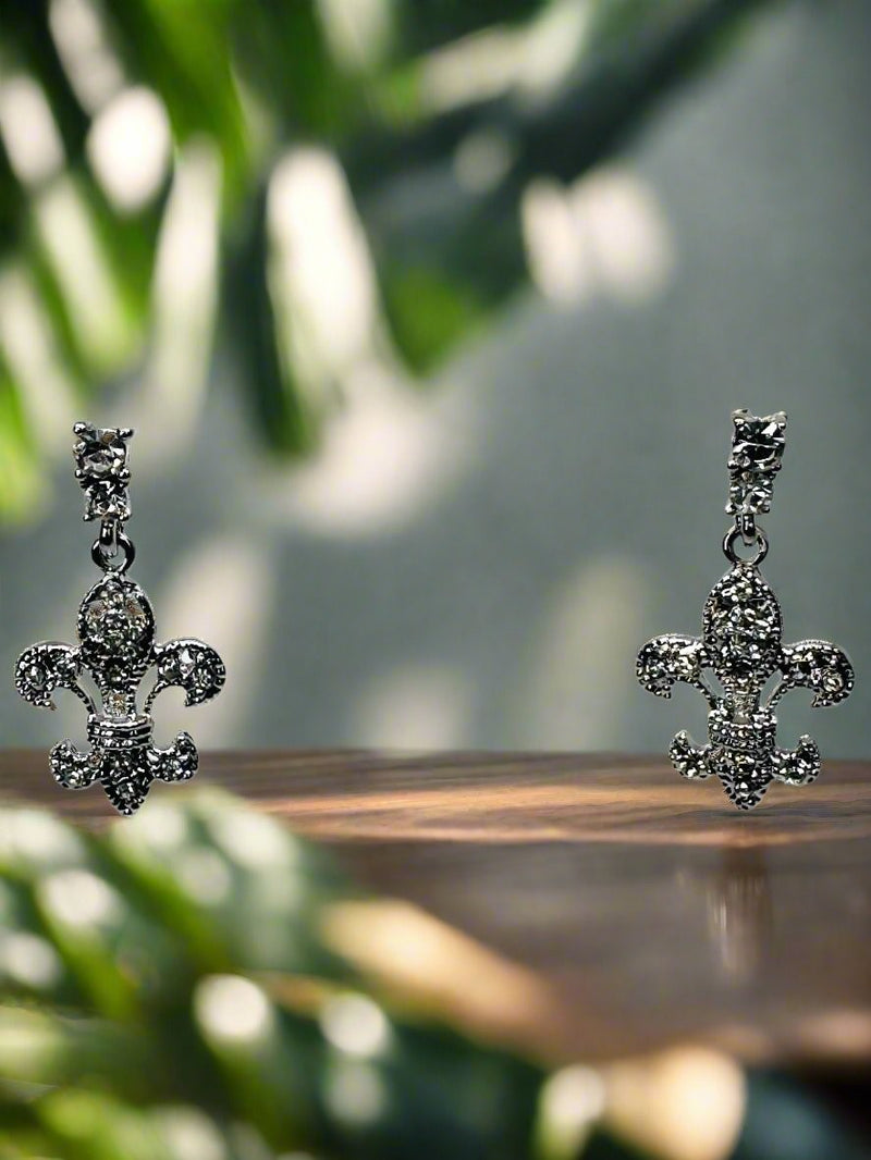 Pierced 1 1/4" silver and clear stone dangle Fleur De Lis earrings