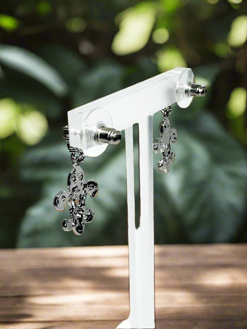 Pierced 1 1/4" silver and clear stone dangle Fleur De Lis earrings