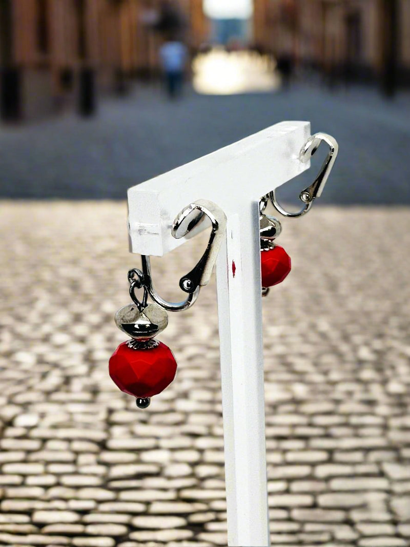 Clip on 1 1/2" silver earrings with red dangle bead