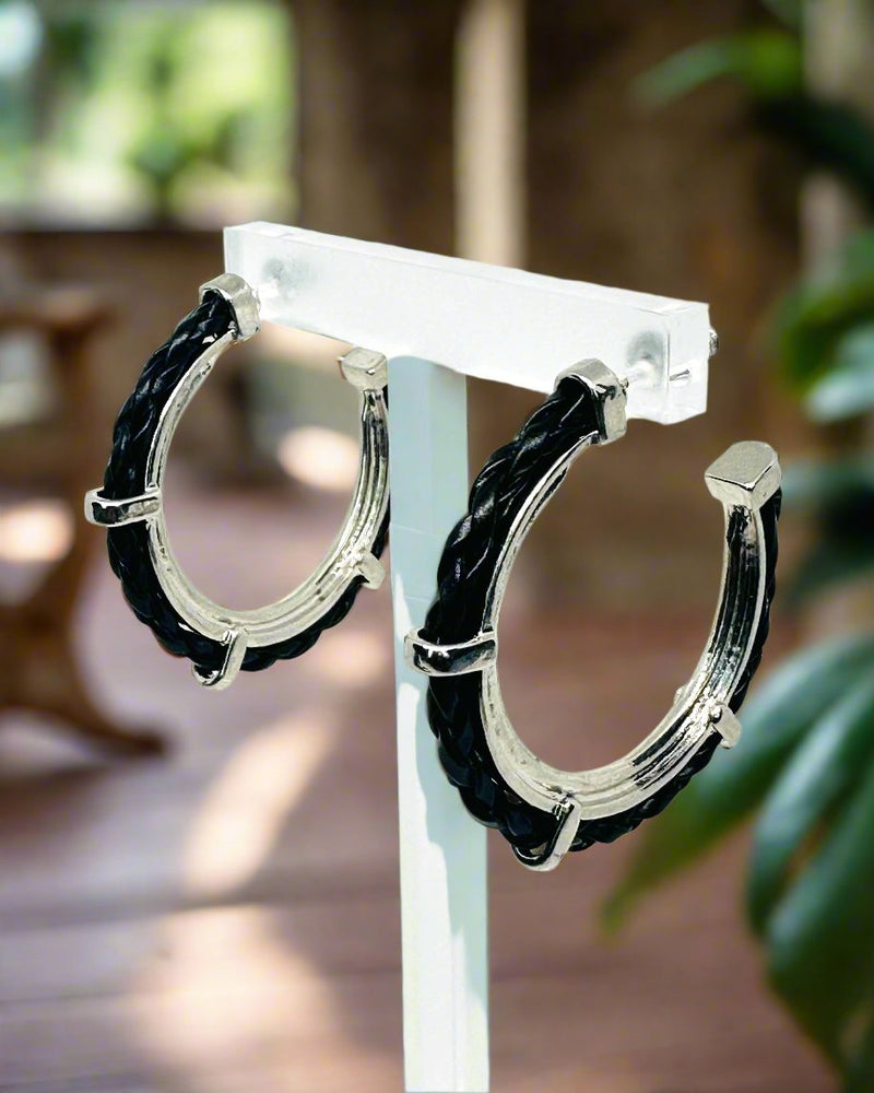 Pierced 1 3/4" silver and black twisted edge hoop earrings