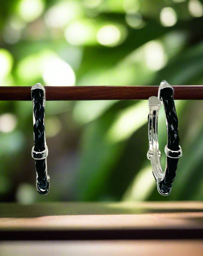 Pierced 1 3/4" silver and black twisted edge hoop earrings