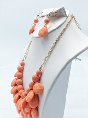Clip on gold chain and orange teardrop bead necklace and earring set