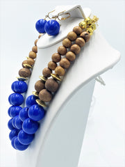 Clip on gold multi strand, wood, and blue bead necklace and earring set