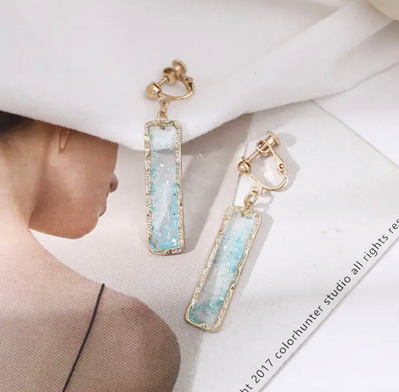 Clip on 2" gold and clear turquoise glitter long square dangle earrings