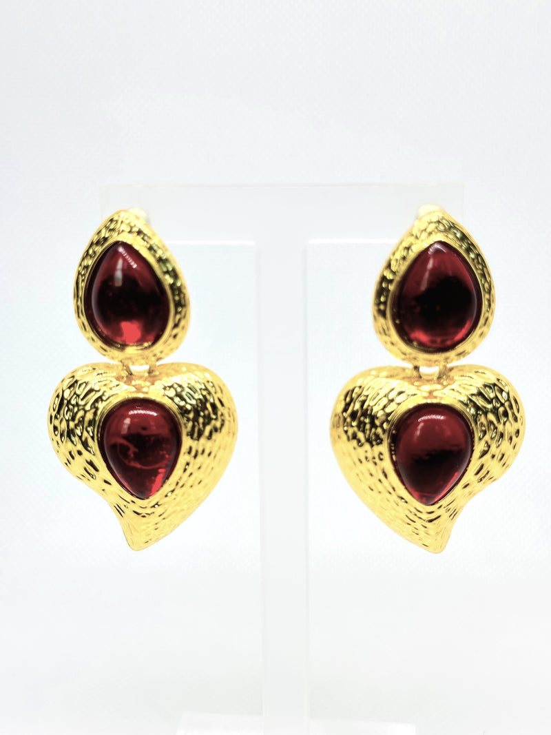 Pierced 2 1/2" textured gold and red stone dangle heart earrings