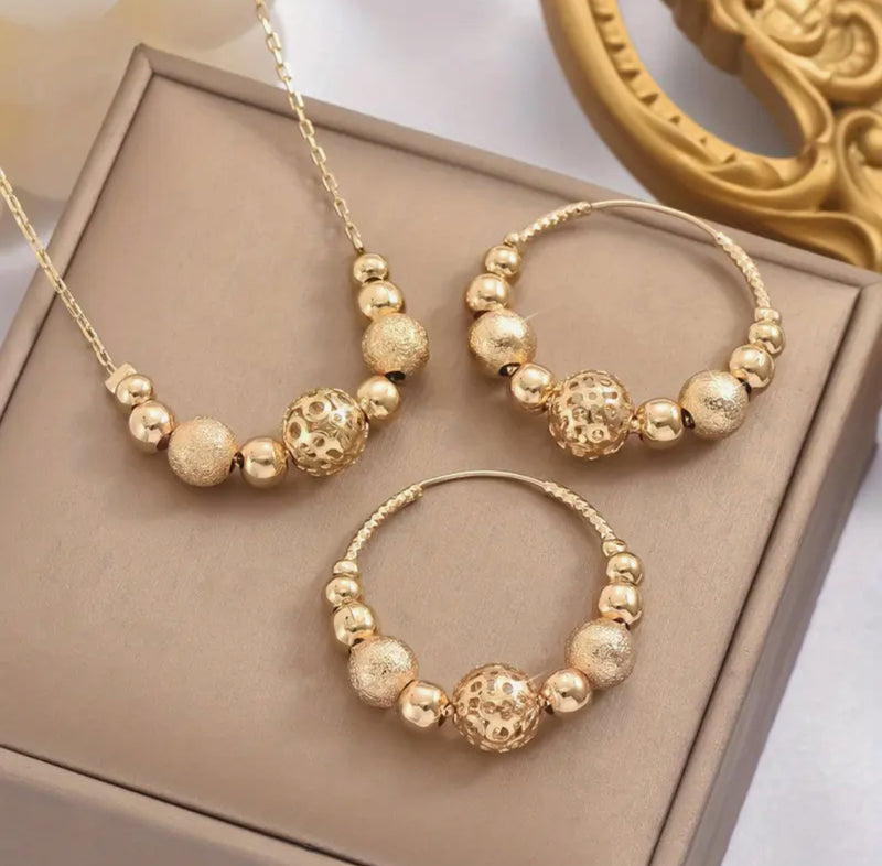 Pierced gold chain and frosted bead necklace and hoop earring set