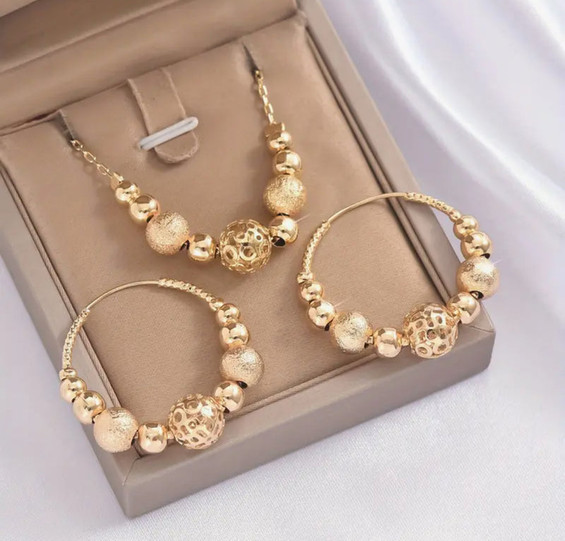 Pierced gold chain and frosted bead necklace and hoop earring set