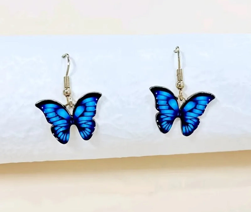Pierced 1 1/4" gold, blue and black dangle butterfly earrings