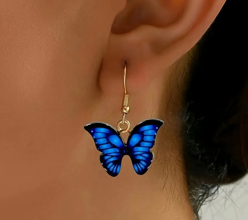 Pierced 1 1/4" gold, blue and black dangle butterfly earrings
