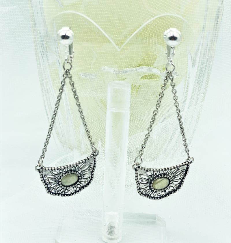 Clip on 3" silver and clear stone graduated stick style earrings
