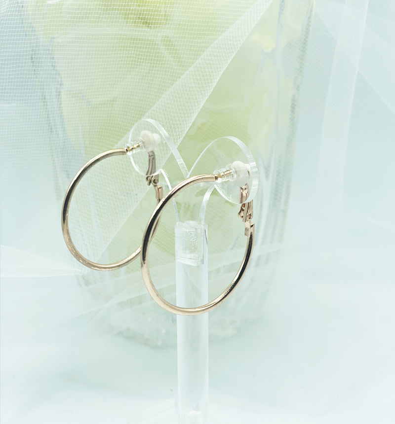 Clip on 1 1/2" shiny rose gold hoop earrings