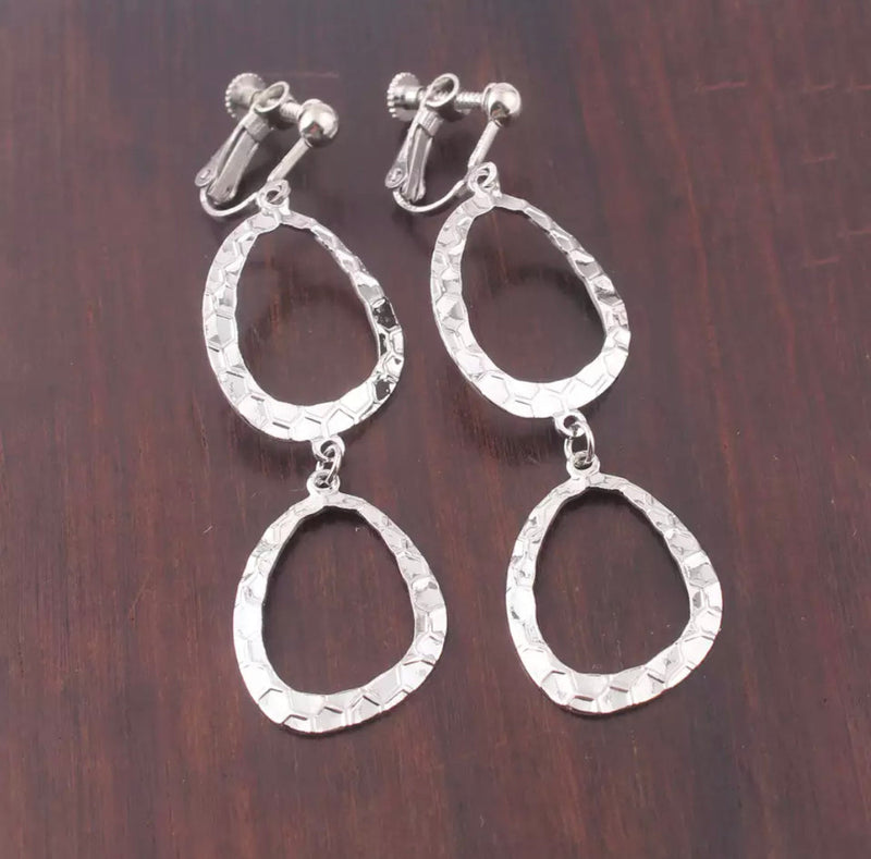 Clip on 2 3/4" silver hammered odd shaped dangle hoops