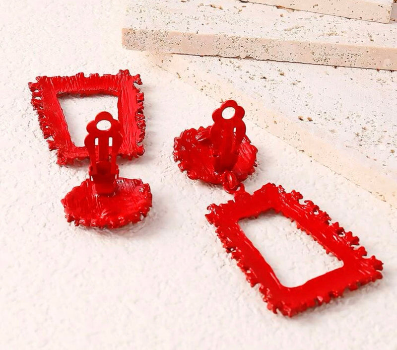 Clip on 2 3/4" red textured dangle square earrings