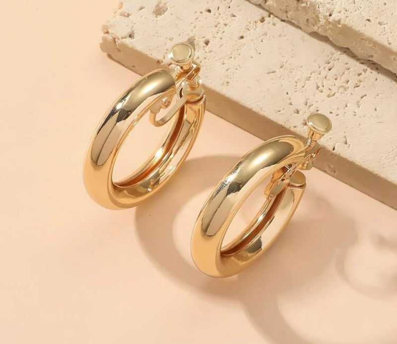 Trendy 1 1/2" clip on shiny gold open back hollow center hoop earrings